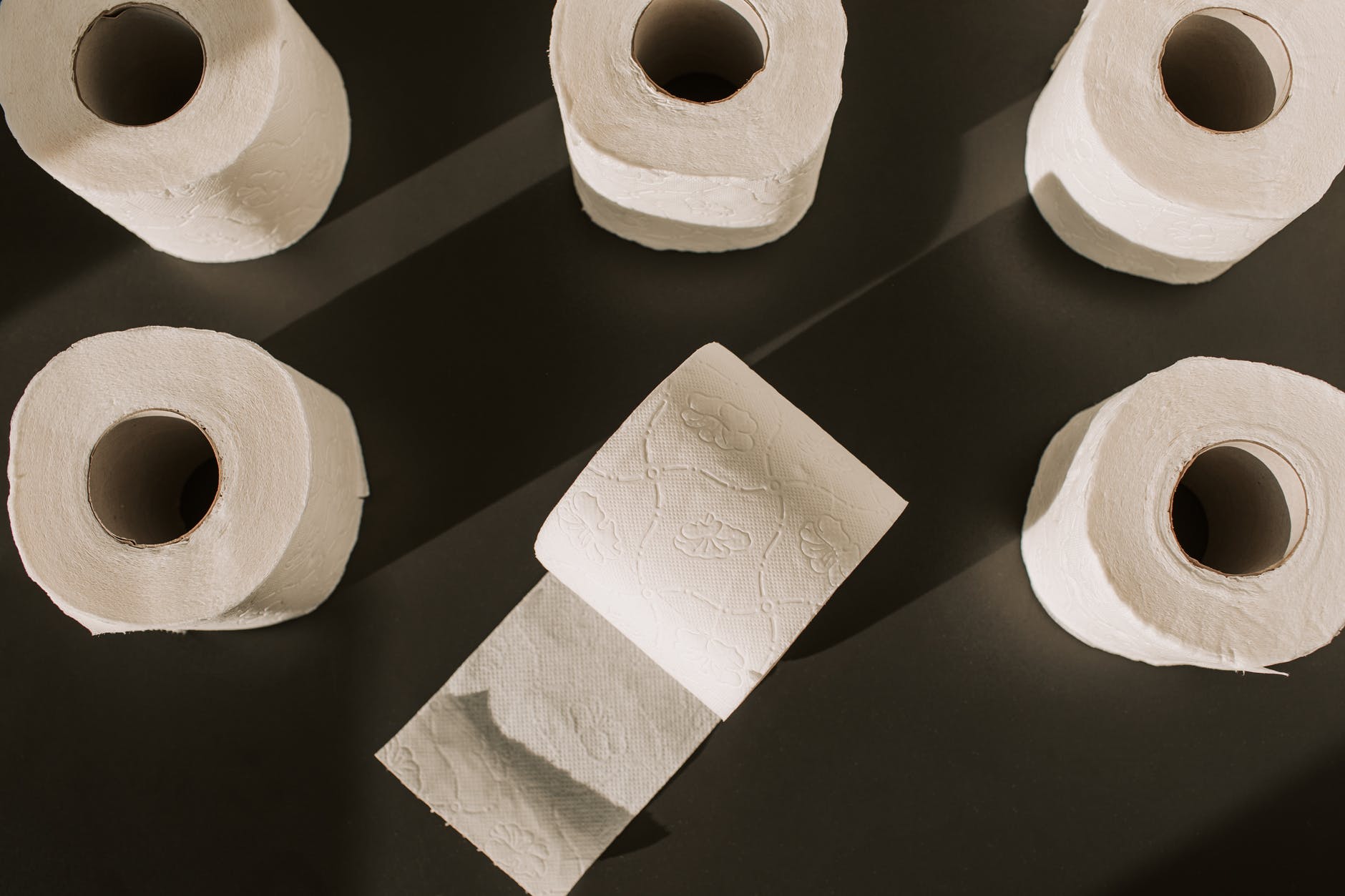 toilet paper rolls on the floor