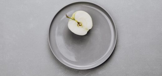 an apple on a gray plate