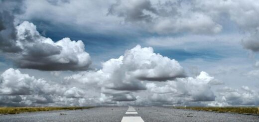 gray rolled asphalt road under cloudy sky